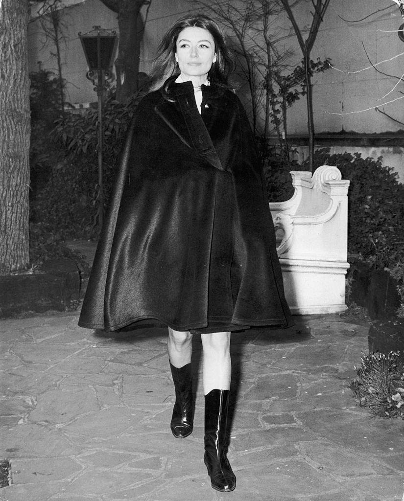 Anouk Aimee wearing a black coat, 1970.