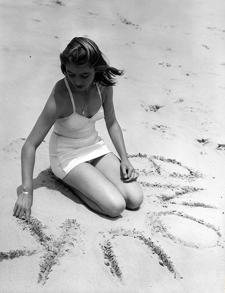Anouk Aimee on the beach, 1950s.