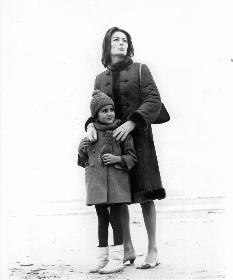 Anouk Aimée with child in a scene from the film 'A Man And A Woman', 1966.