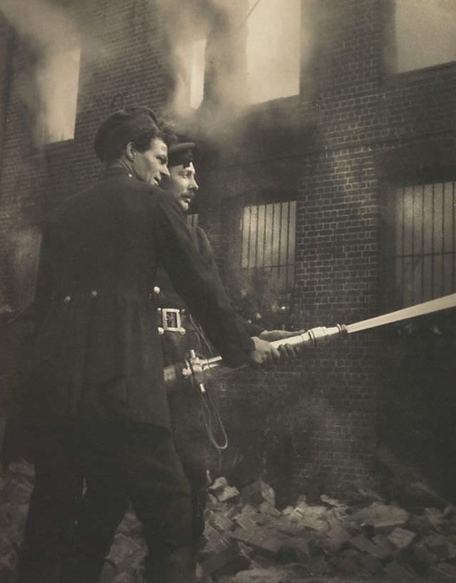 Boys with hose, fire at Redfern, 1919