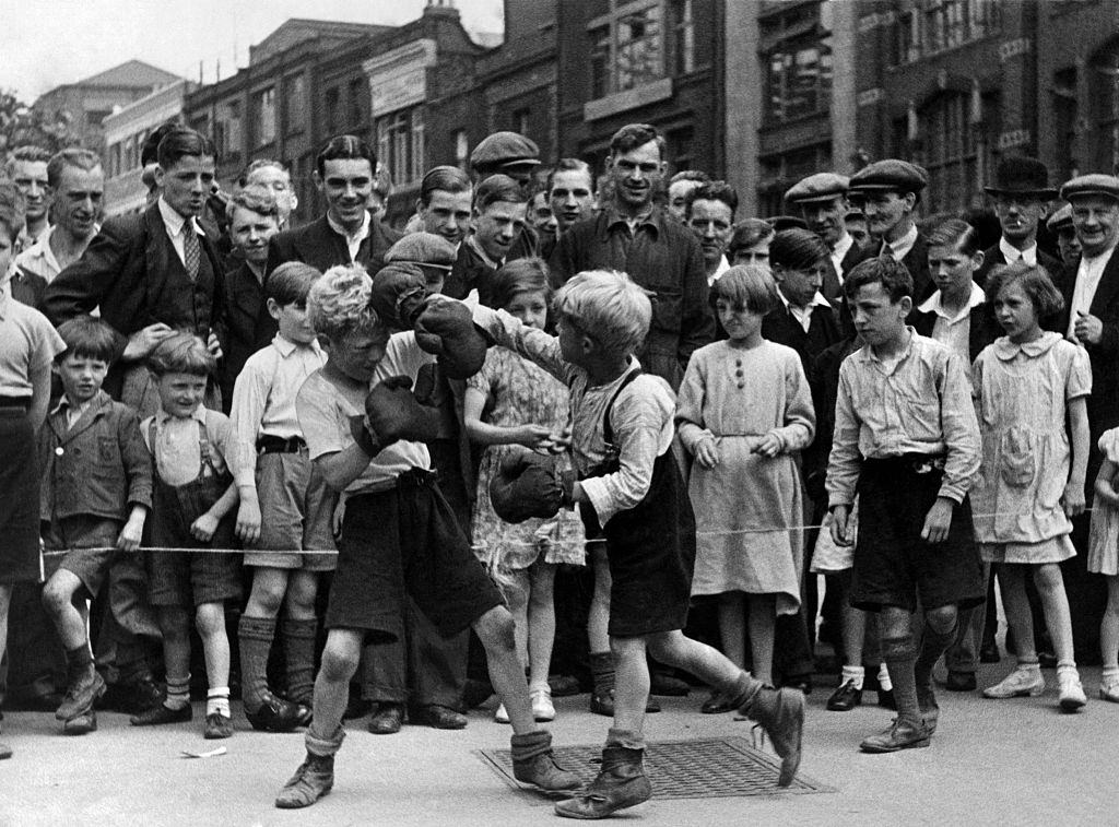 Boxing match in the street at Clerkenwell Green, a company of little boys arranged a boxing match.