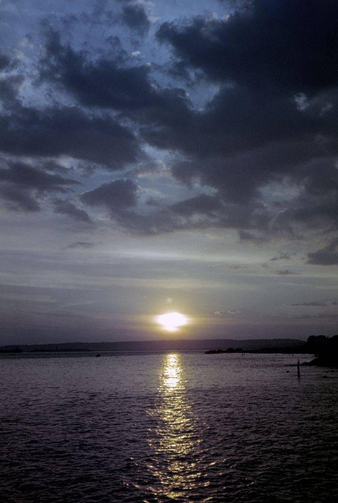 The sun sets off Coney Island beach, 1948.