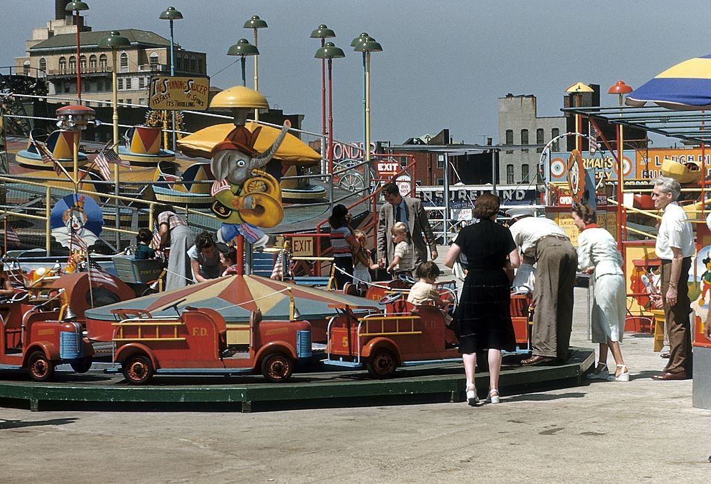 A view of Thew Spinning saucer and other rides at Coney Island, 1948.