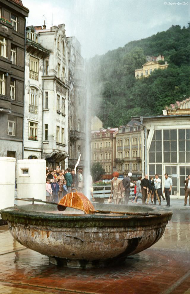 Fashion model posing in front of a hot spring, Karlovy Vary (Carlsbad)