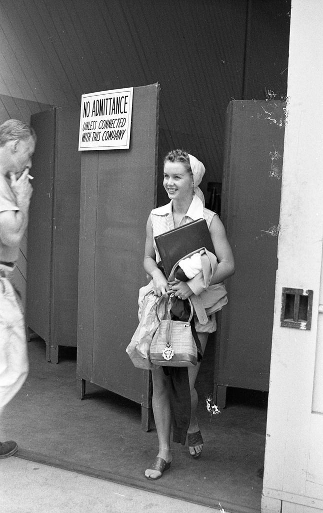 Debbie Reynolds as she steps through a door on the lot of MGM studios, 1948.