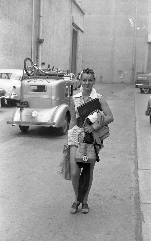 Debbie Reynolds walks along a street, 1948.