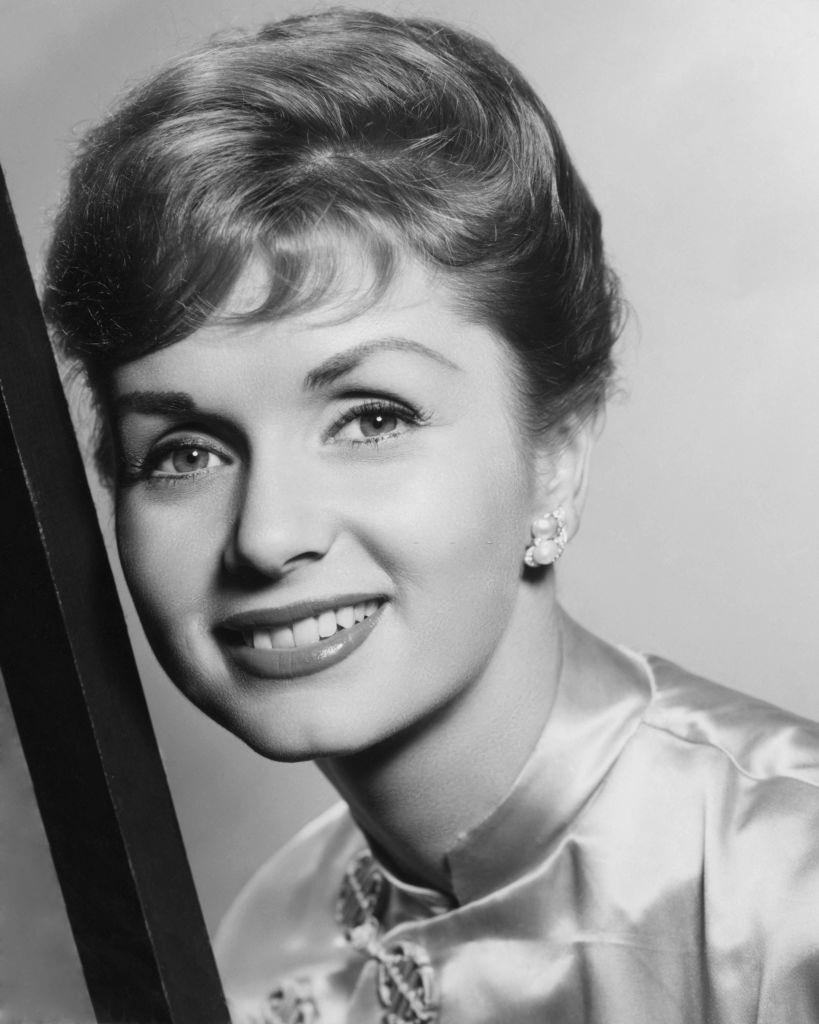 Debbie Reynolds pictured smiling in a publicity portrait, 1950.