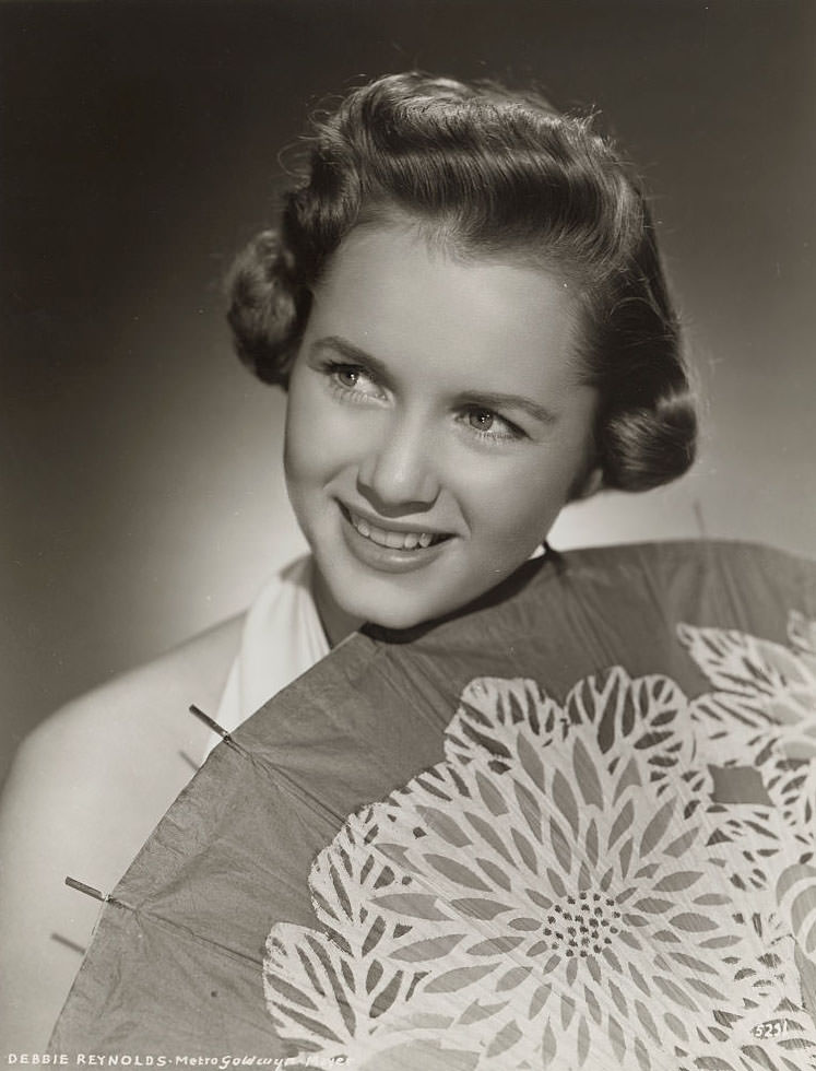 Actress Debbie Reynolds holding Parasol, 1955.