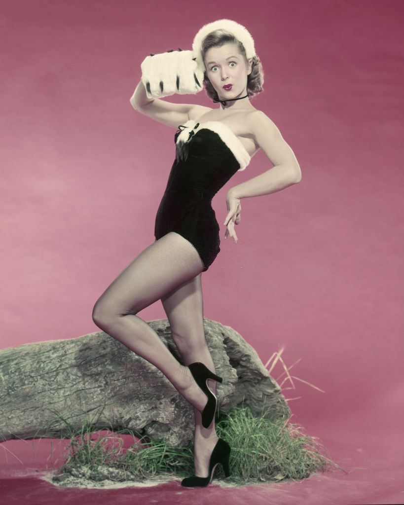 Debbie Reynolds wearing a leotard and fur muff, 1955.