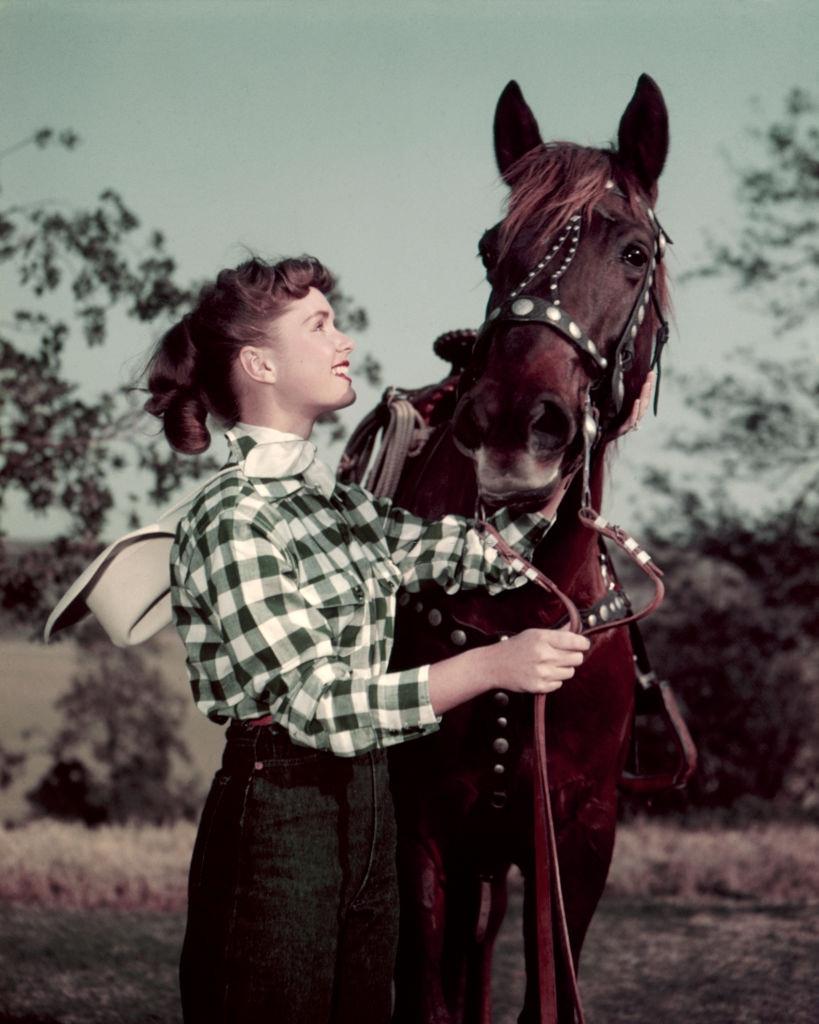 Debbie Reynolds with a horse, 1955.