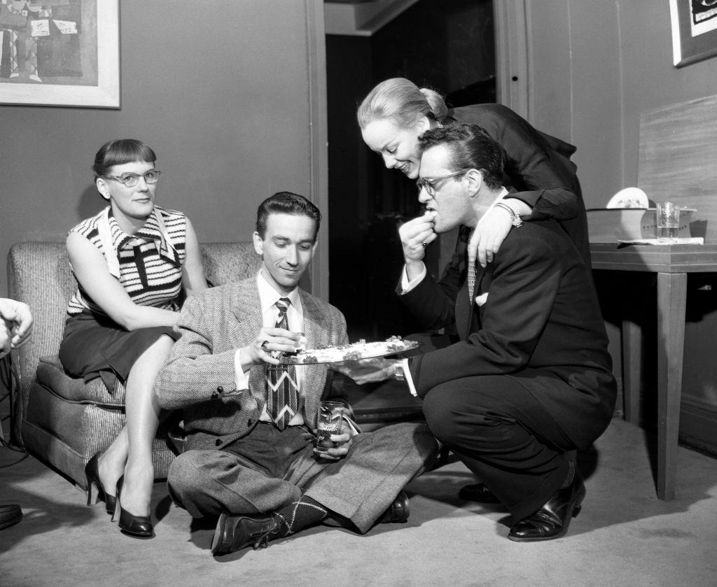 Faye Emerson with Robert Q. Lewis entertaining friends at his apartment in the Beverly Hotel, 1960.