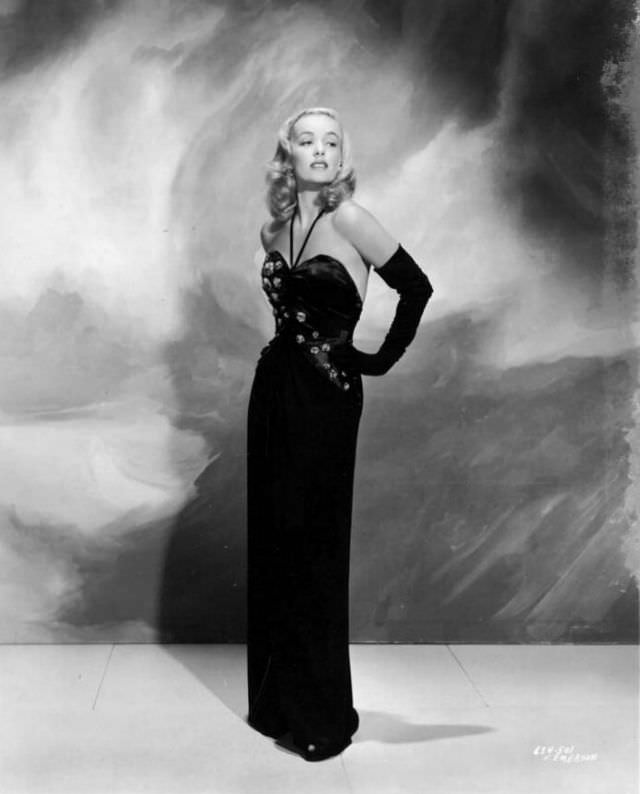 Faye Emerson in black dress, 1955.