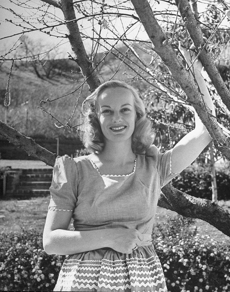 Faye Emerson, standing in her yard, 1945.