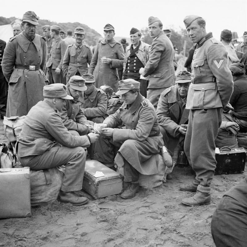 German prisoners of war from Elverum camp being processed prior to embarkation from Norway to Germany.