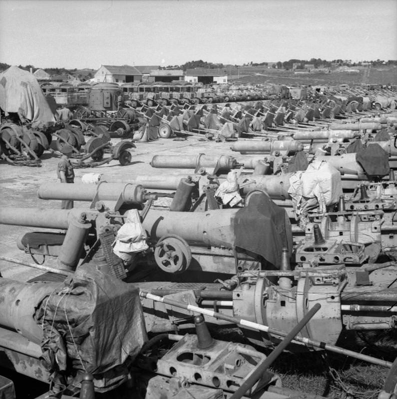 A collection of German military equipment including artillery pieces, searchlights, tanks and lorries at Solar aerodrome, Stavanger.
