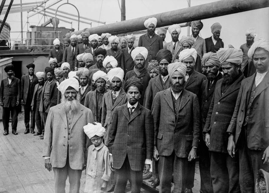 Organizer Gurdit Singh Sandhu (front left) and other passengers pose for a photo.