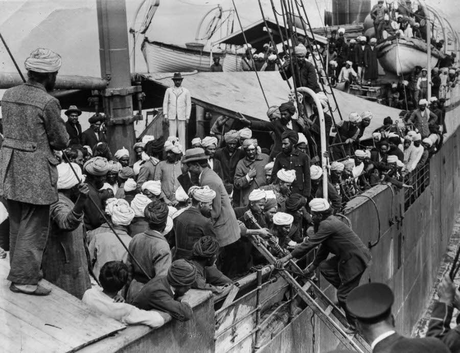 Passengers crowd the deck as officials and journalists board.