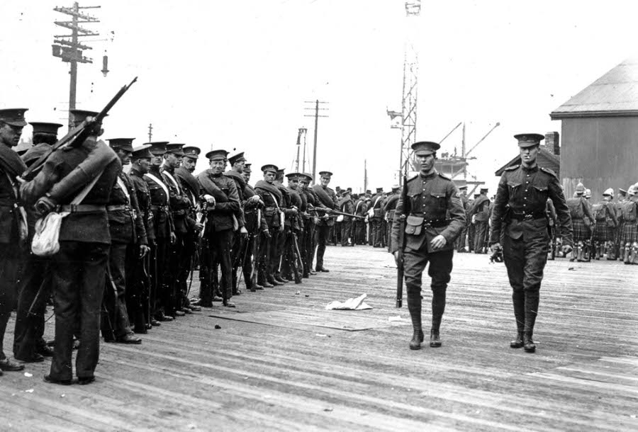 The Canadian military assembles on a Vancouver pier.