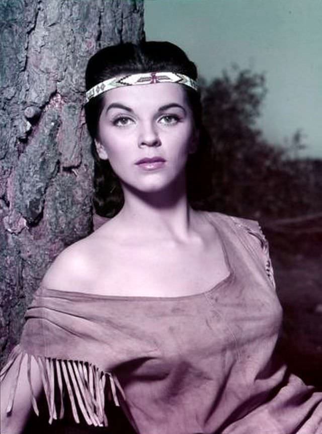 Lisa Gaye leaning with a tree, 1950s.