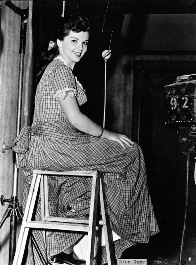 Lisa Gaye sitting on the stool.