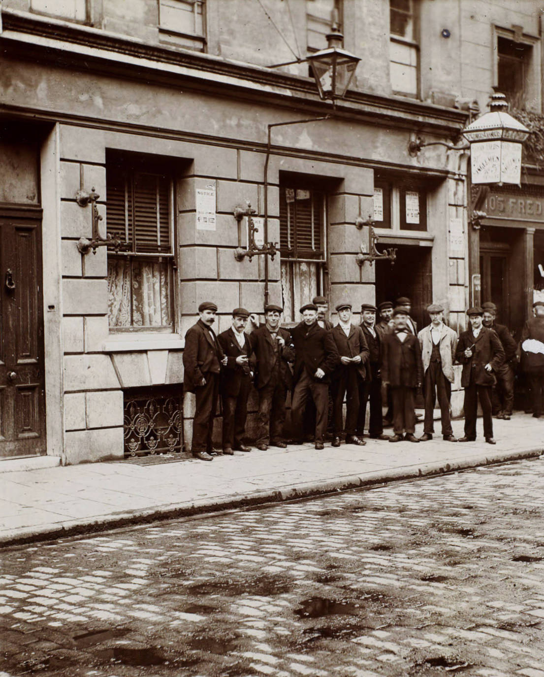 Two relay system lodging, lodgers who have been on night work waiting till the beds of a doss house are vacated by men employed during the way.