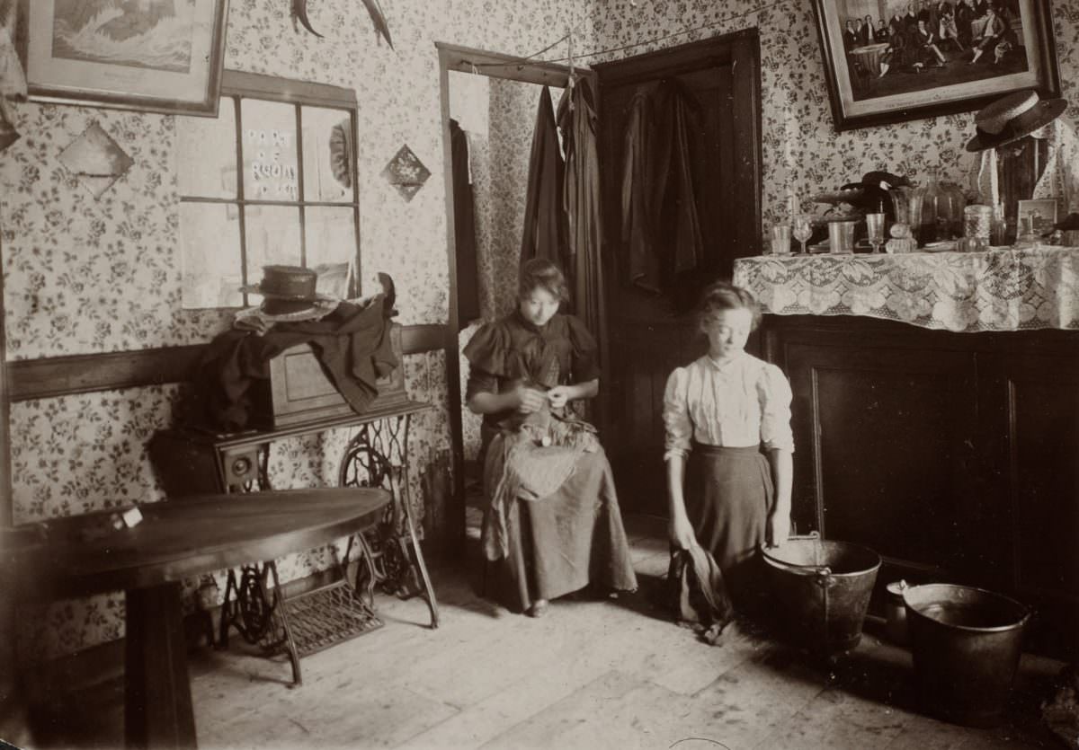 Part of a room to let. A typical East End home where the people live, sleep, eat all in one room.