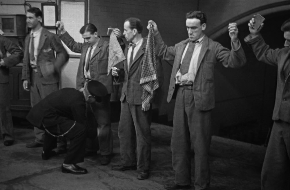 A prison officer frisking prisoners during the “rub-down” at Strangeways Prison