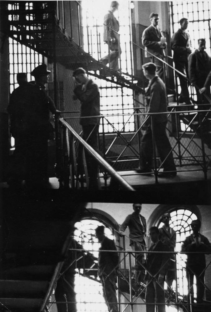 Prison officers watch over prisoners at Strangeways Prison.