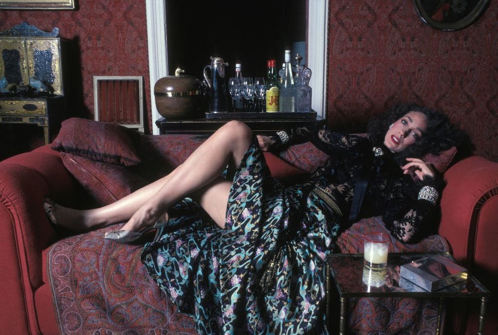 Marisa Berenson posing on the sofa, 1981.