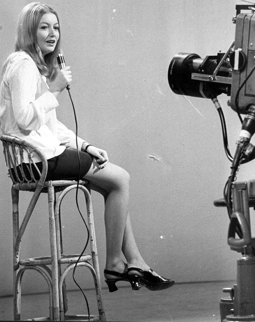 Mary Hopkin is filmed for television singing her single 'Those Were The Days', 1968.