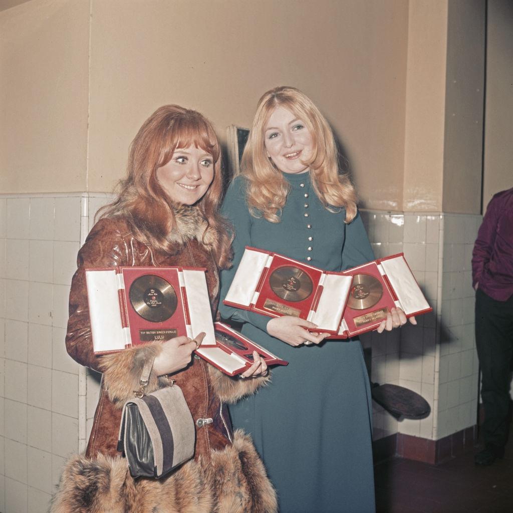 Mary Hopkin with Marie MacDonald clutching awards they were presented at the Disc And Music Echo Valentine's Day Award, 1969.