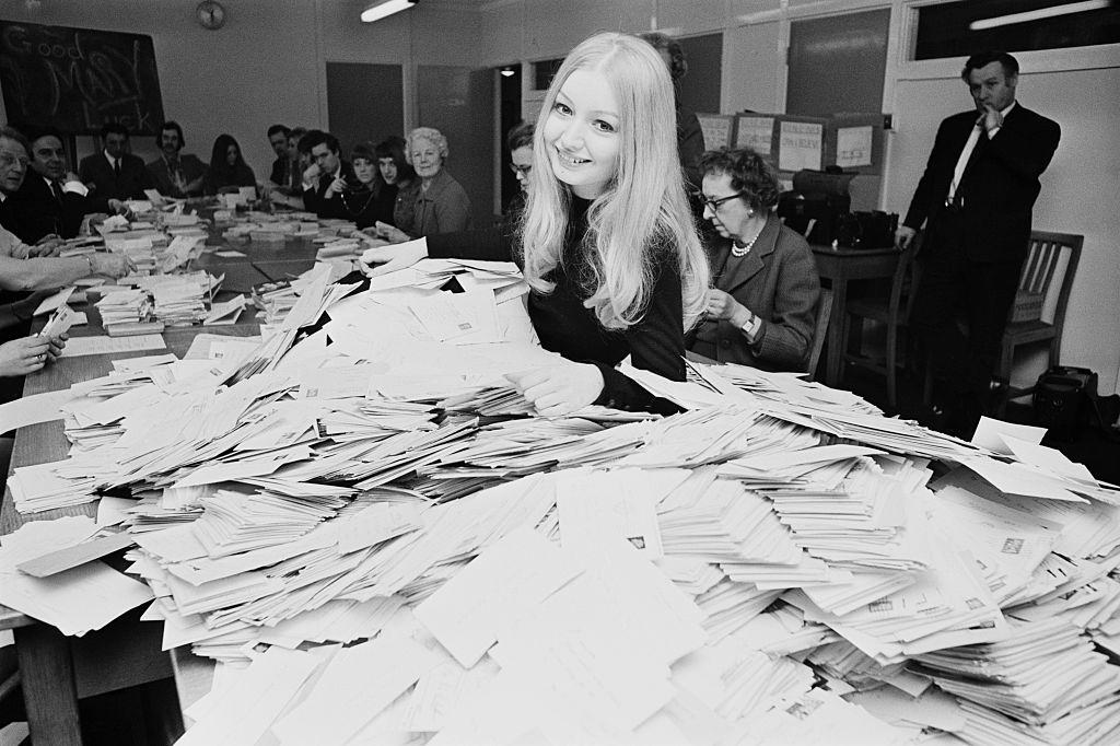 Mary Hopkin sorting postcards at the BBC to decide which song she will sing in the upcoming Eurovision Song Contest, London, 1970.