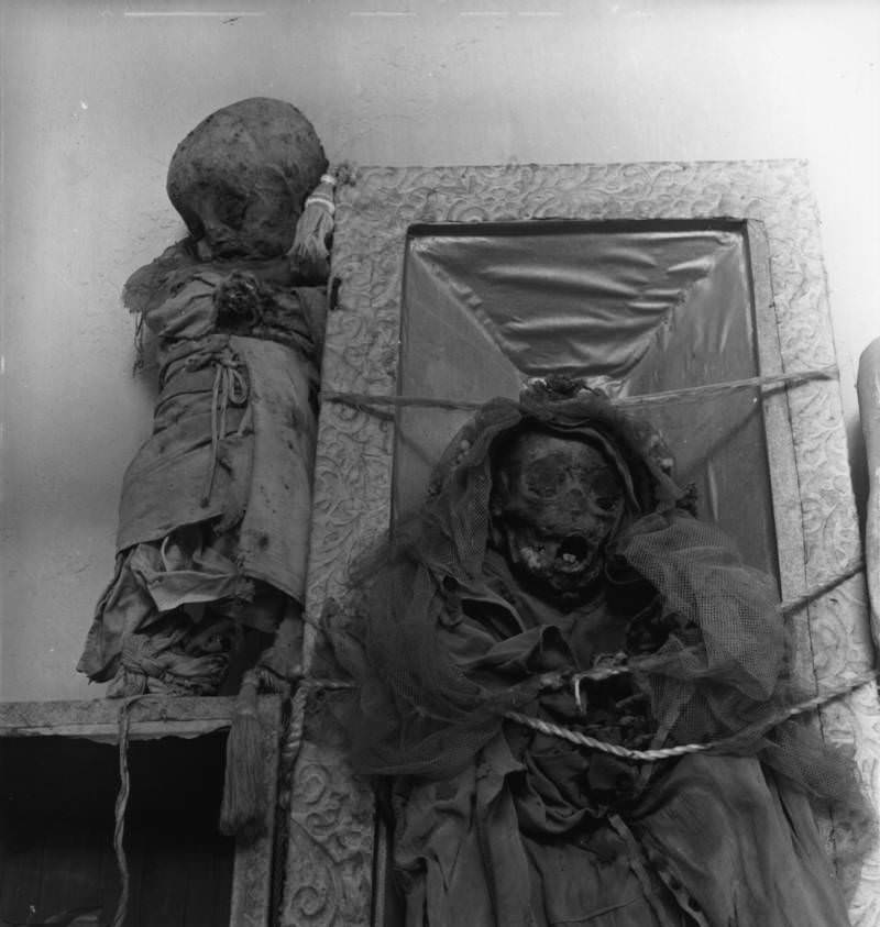 A young girl buried in her communion dress, 1955.