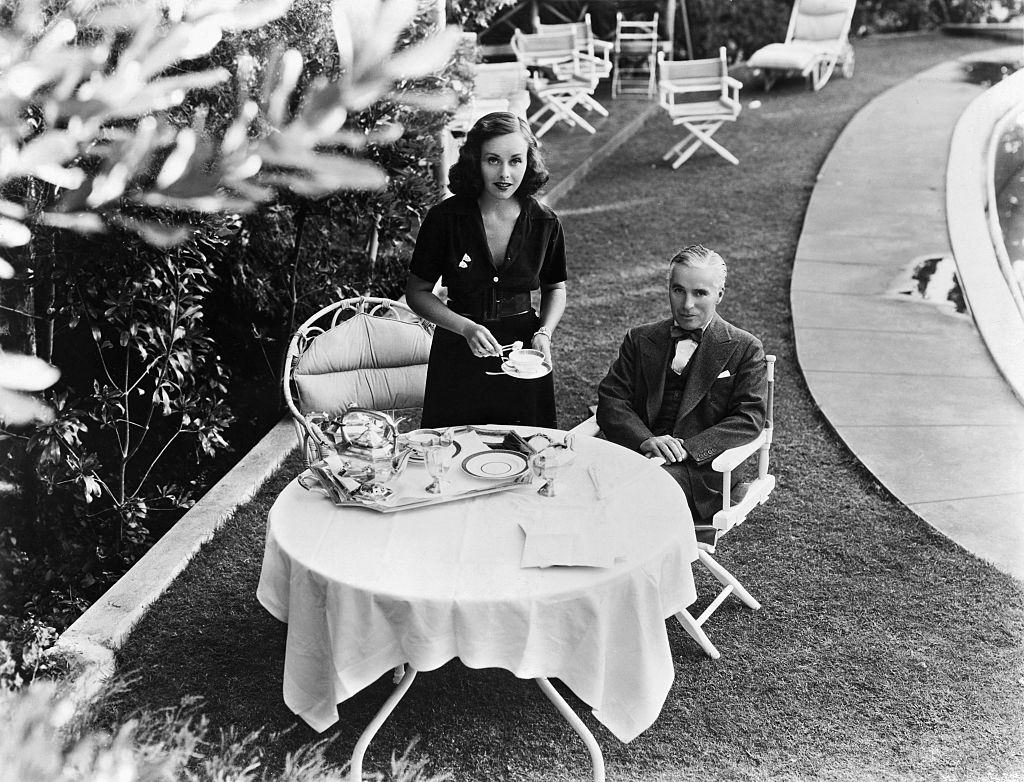 Paulette Goddard serves tea to her husband, 1930s.