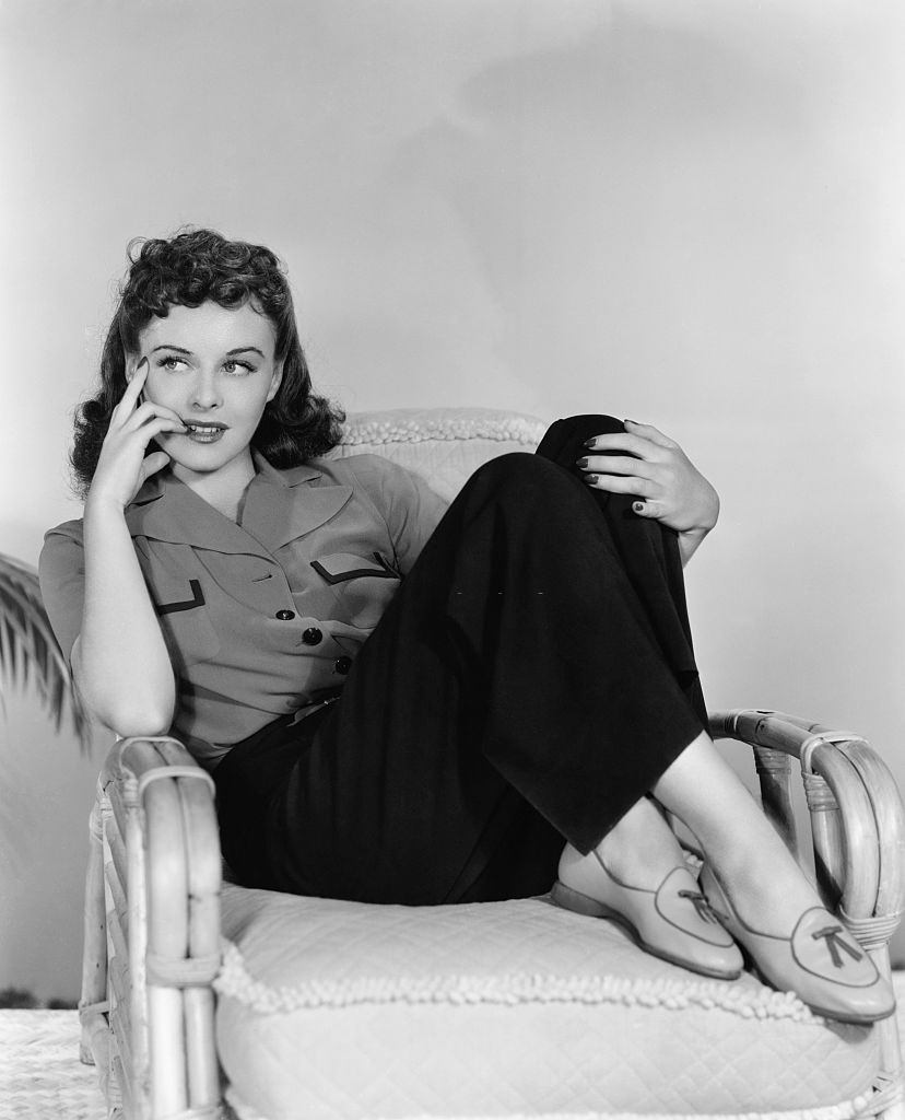 Paulette Goddard sitting on the sofa, 1939.