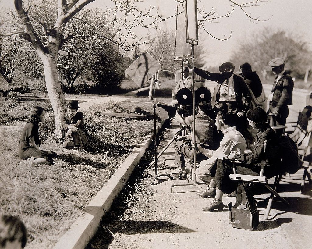 Paulette Goddard with Charlie Chaplin on the set of 'Modern Times', 1936.