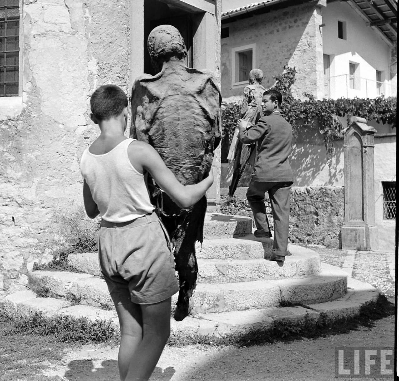 People Living with a Normal Life with Mummies in Venzone, Italy in 1950