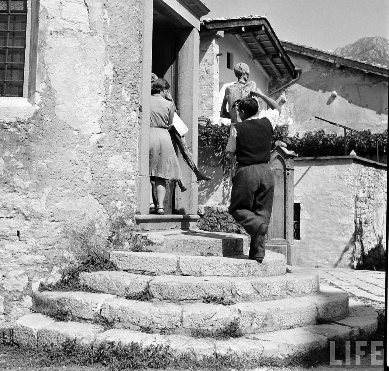 People Living with a Normal Life with Mummies in Venzone, Italy in 1950