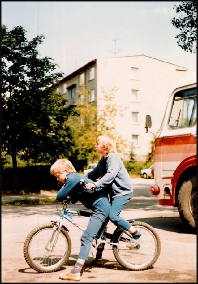 The two children are playing by workers' flats around the Moser glass factory in Karlovy Vary