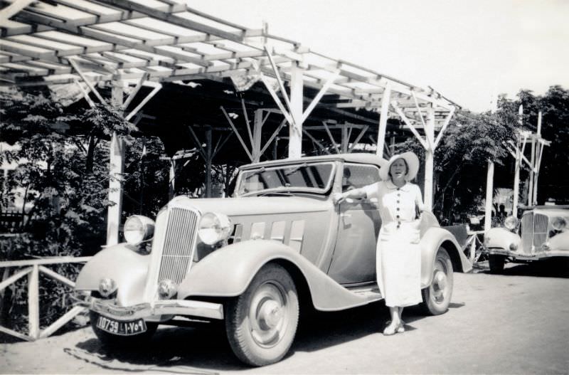 A lady proudly posing with a Renault Primastella Coach Décapotable convertible, apparently taken in the Lebanese summer resort of Broumana, located in the mountains east of Beirut, 1937