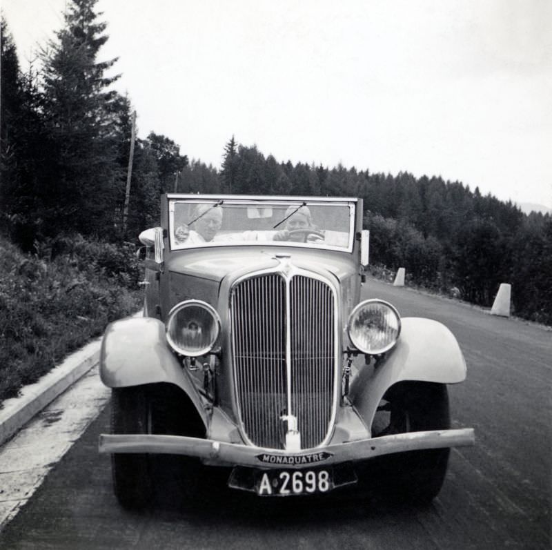 A Renault Monaquatre Cabriolet-Spider pictured on a country road on a bleak summer's day.