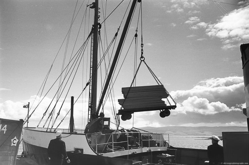 MV Lochiel unloading at dock in the Western Isles, Scotland