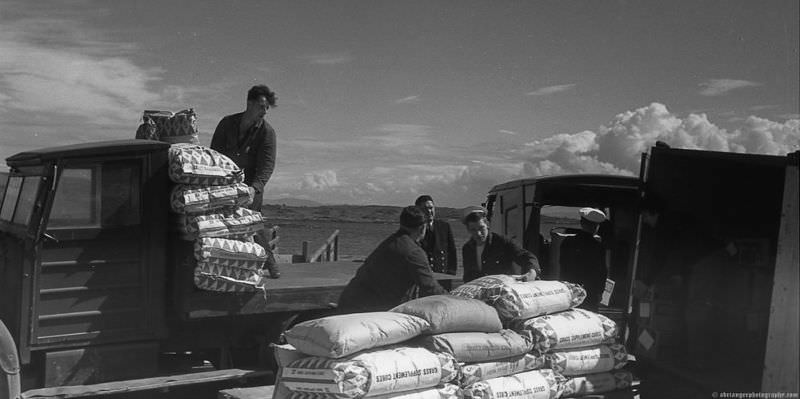 MV Lochiel unloading at dock in the Western Isles, Scotland