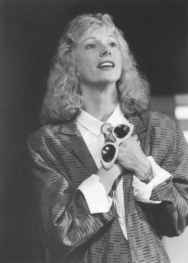 Sondra Locke holding a fancy glasses, 1970s.