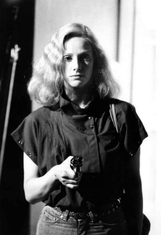 Sondra Locke with a gun from a movie scene, 1960s.
