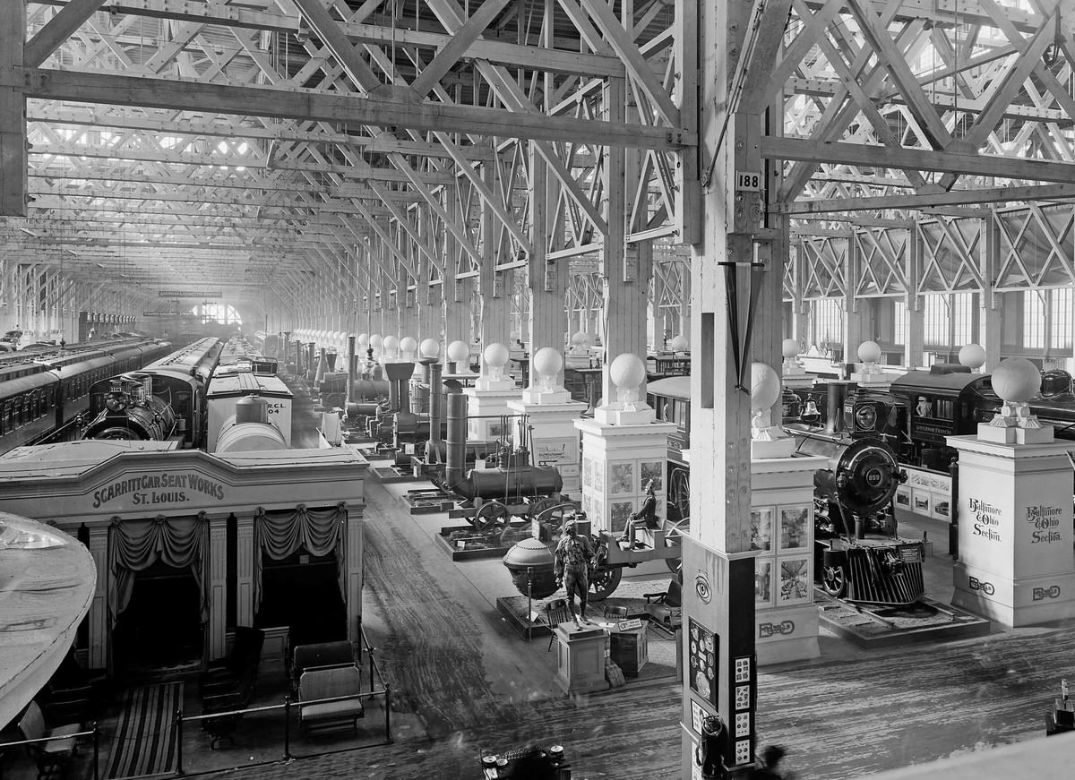 An exhibit of historic locomotive engines fills part of the huge Palace of Transportation.