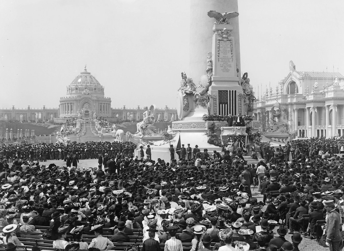 On April 30, 1904—the opening day of the 1904 St. Louis World's Fair—William H. Thompson, the president of the National Bank of Commerce in St. Louis, stands on the dais at the Louisiana Monument in the Plaza of St. Louis.