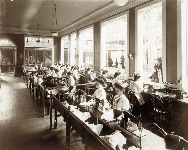 Operators making corsets as part of the Singer Sewing Machine exhibit in the Palace of Manufactures at the 1904 World's Fair, 1904