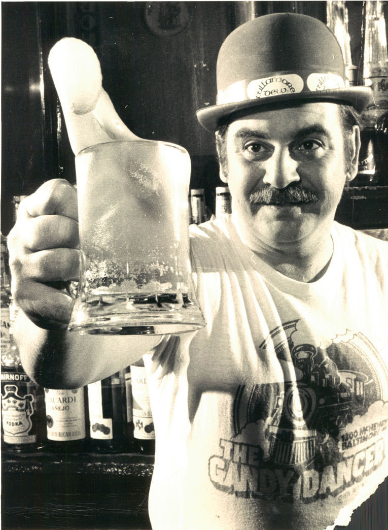 Erin go slosh! With green suds flying, Noel Bautro toasts the advent of St. Patrick’s Day among fellow Irish-at-least-for-a-week at the Gandy Dancer in the 1300 block McHenry Street. March 1979