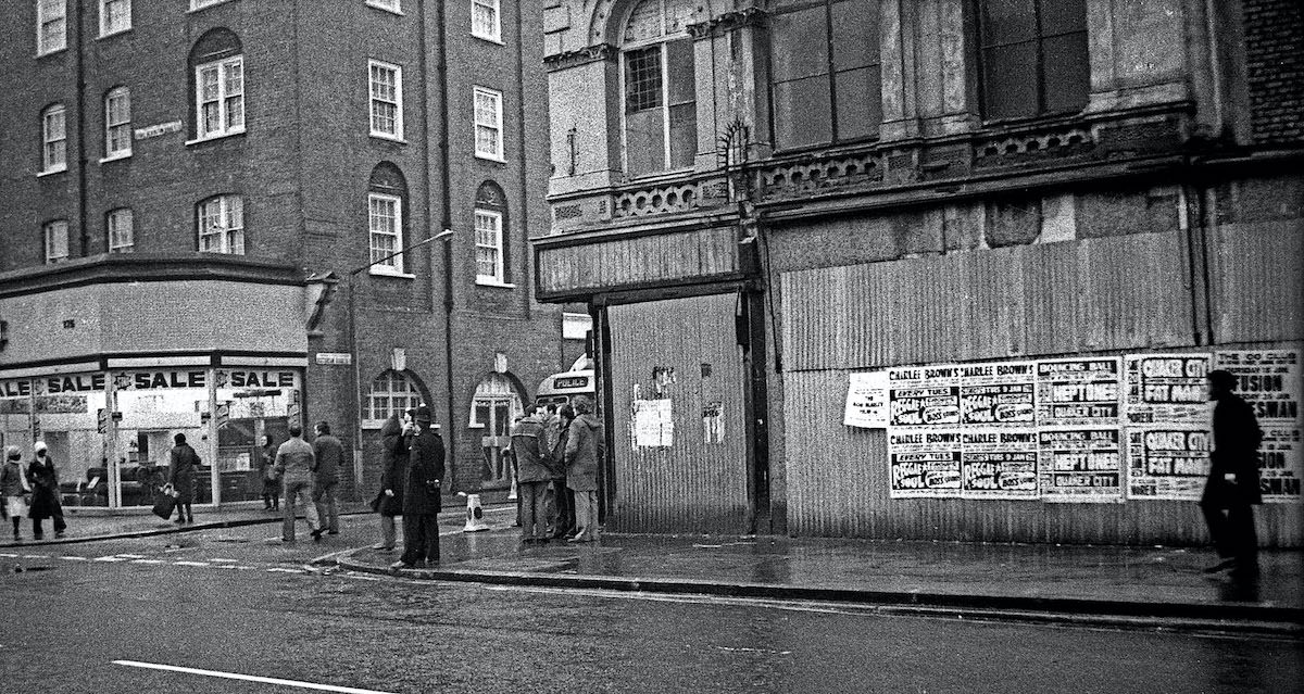 Michael Ferreira’s funeral 1979 – a group of plainclothes policemen wait on the corner of Victorian Road.